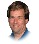 Headshot of a man with brown hair.